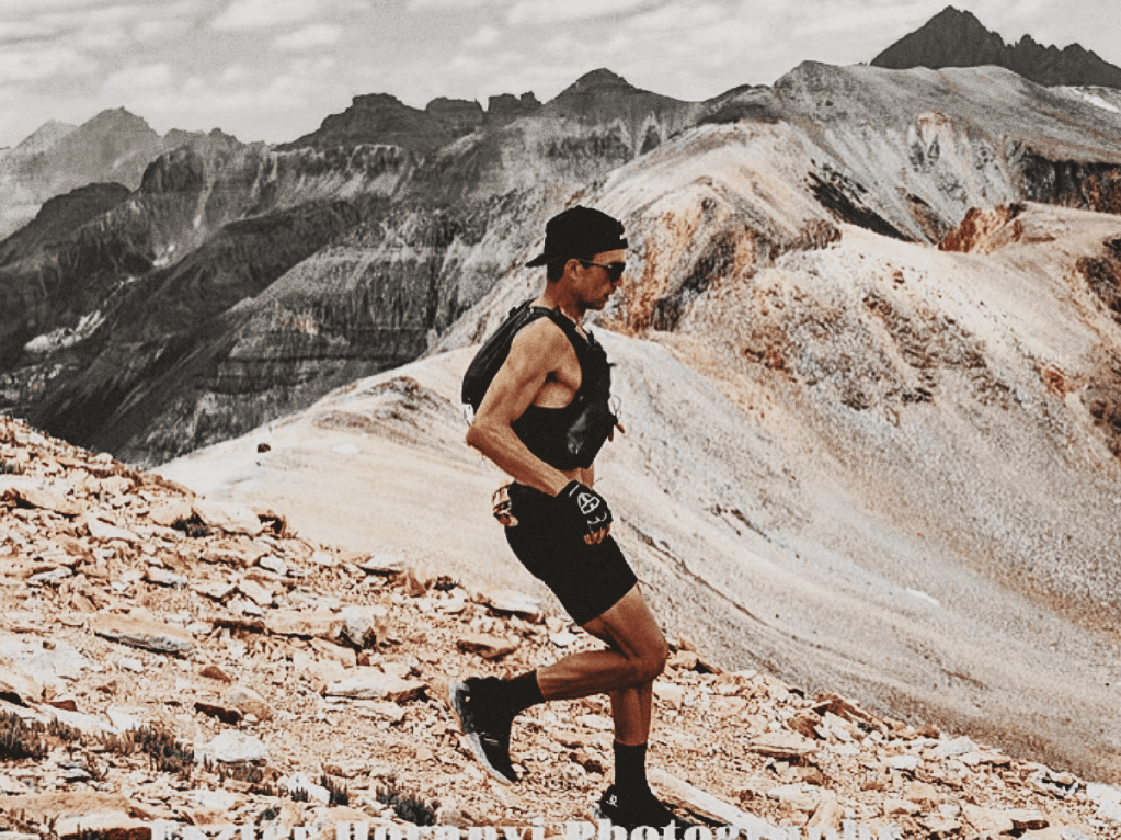 A lone ultramarathoner Alex Griffin descending the steep slopes of Imogene Pass during the  Ouray 100 Endurance Run in Colorado