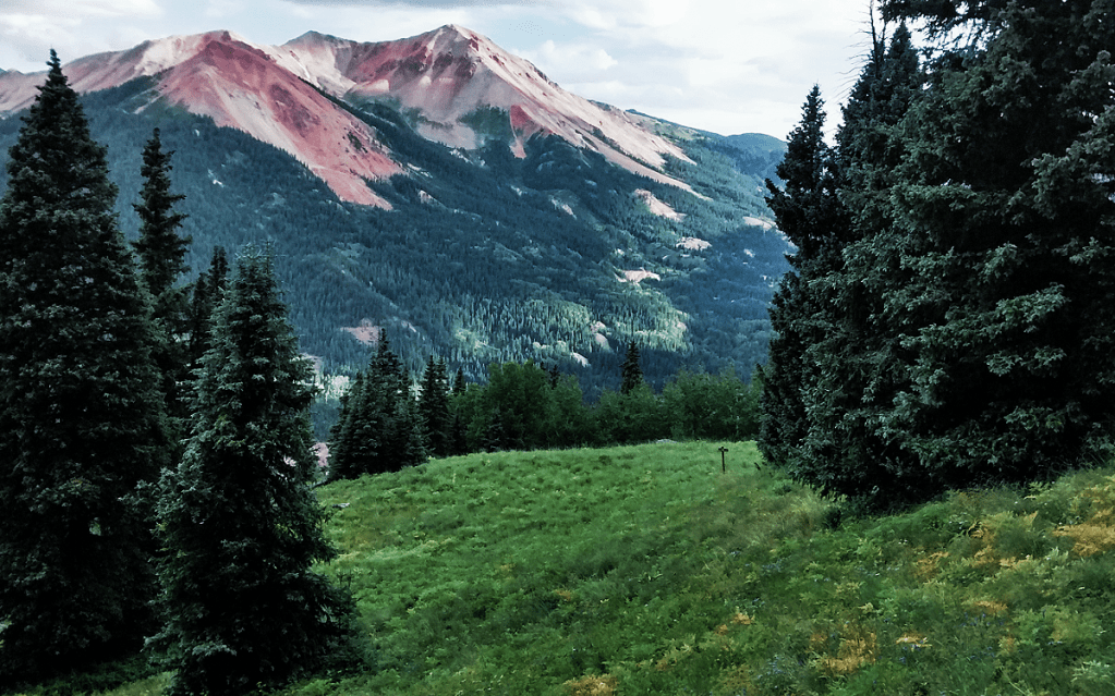 An incredibly scenic view from Richmond Pass looking out to the dramatic double mountain peaks of Red Mountain 1 & 2 in the San Juan Mountains